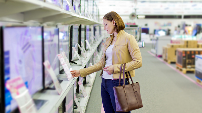 Woman shopping for televisions