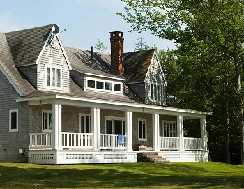 Single-family home with a wraparound porch, representing personalized mortgage rates and home financing.