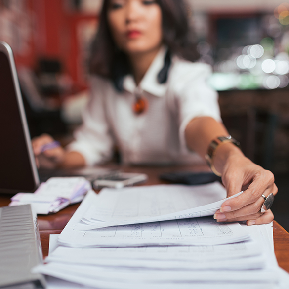 Woman at desk paying bills