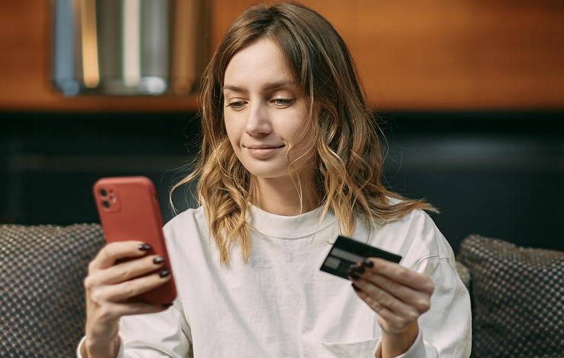 Girl smiling at mobile phone